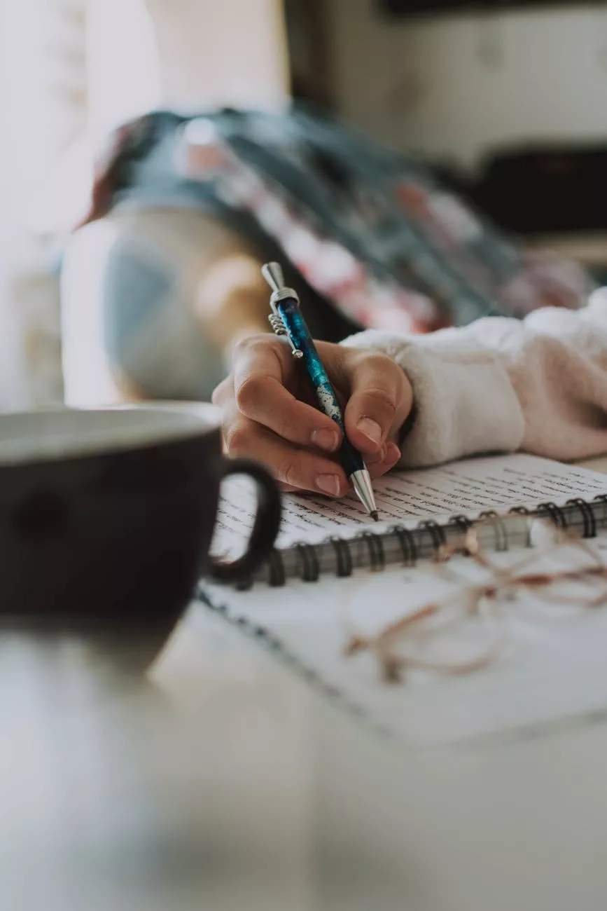 person sketching on paper